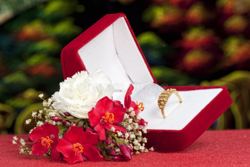 Flowers and wedding rings stock image. Image of rings - 24649841
