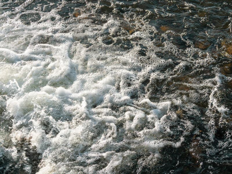 Flowing Dark Water Texture. White Water Foam, Small Whirlpool, Water