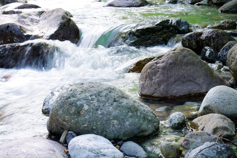 Flowing river. Flowing spring river in the mountains stock photo