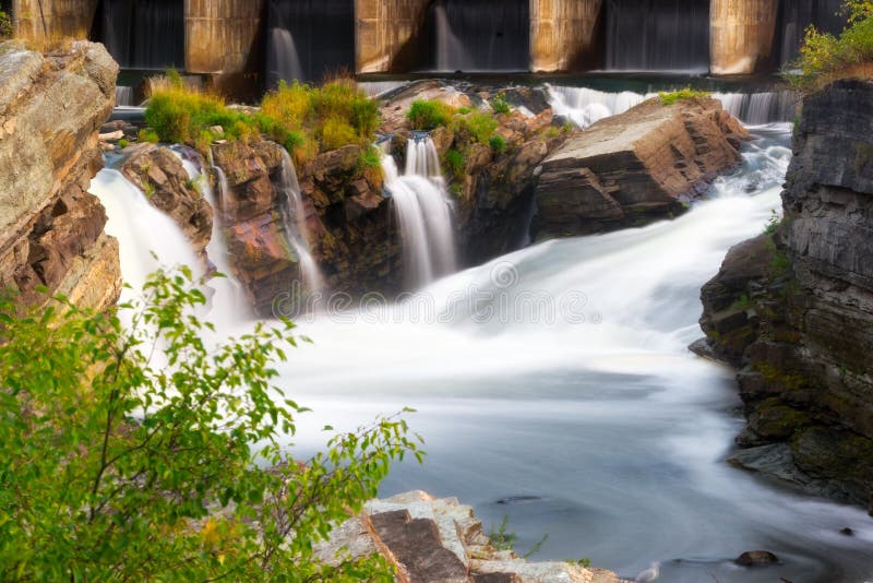 Flowing Water Falls over old Rocks