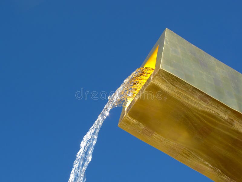 Flowing water from golden fountain