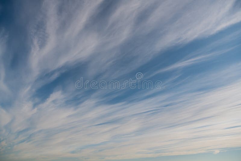 Fluffy clouds and blue sky background