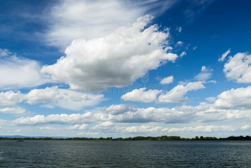 Fluffy clouds over river Danube in Bratislava, Slovakia