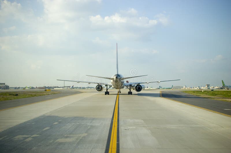 Wide angle view of an airliner from the rear during taxi. Wide angle view of an airliner from the rear during taxi
