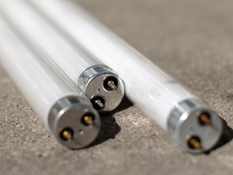 Fluorescent tubing on concrete stock photography