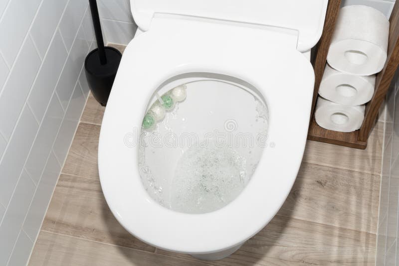 Flushing Toilet Bowl in Restroom with Accessories Stock Image Image