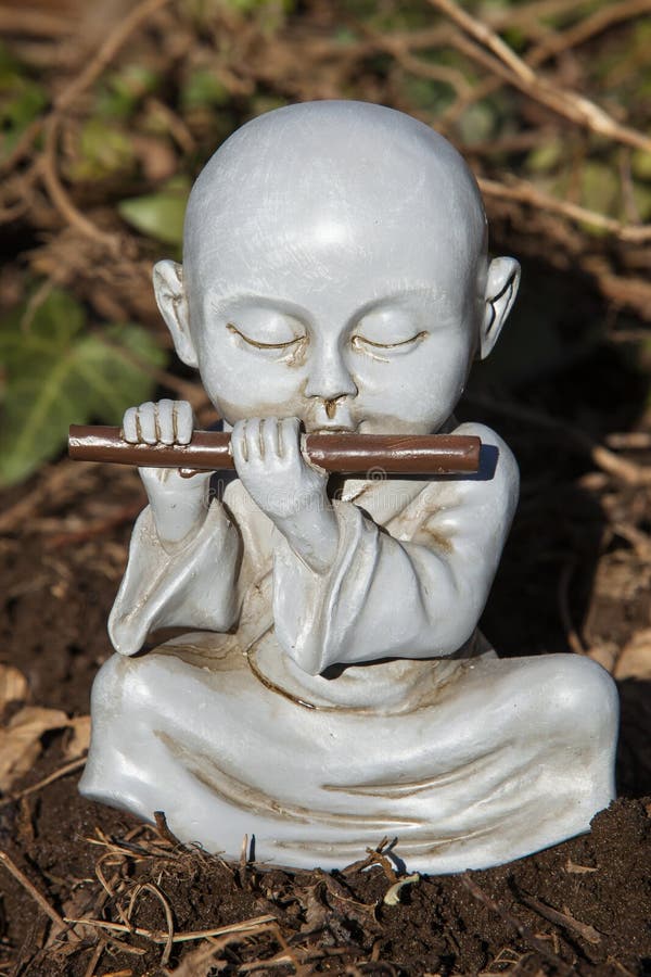 Flute Monk stock image. Image of yard, monk, statue, decor 67279329