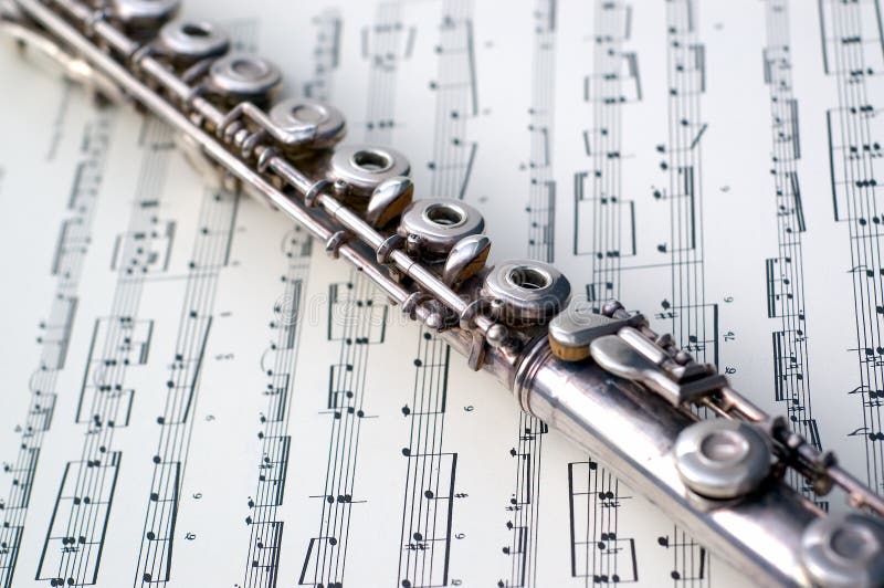 A flute on sheet music stock image. Image of flute, sound 2373579