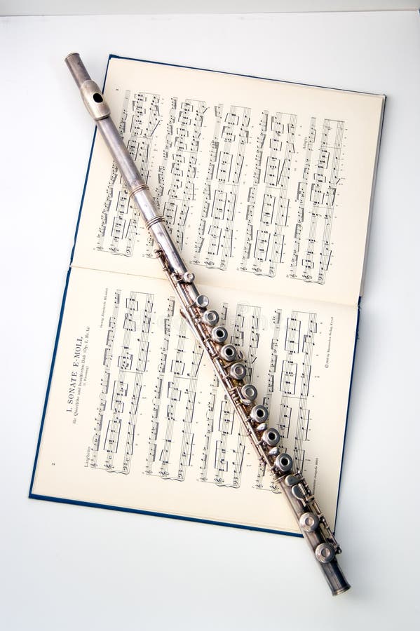 A flute on sheet music stock image. Image of sound, artistry 2373605