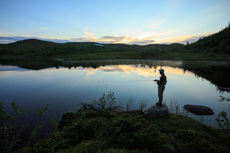 Fly fishing on the mountian lake royalty free stock photos Fly fishing on the mountian lake royalty free stock photos