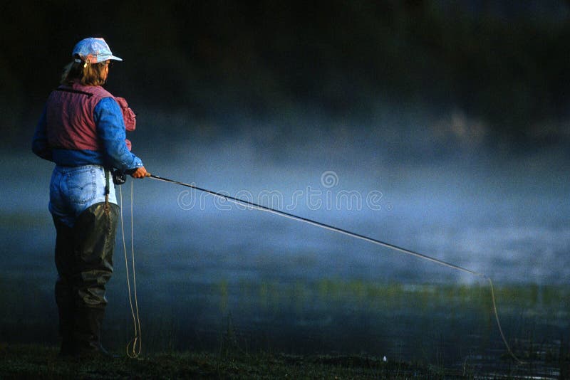 Fly fishing woman 01 stock photos Fly fishing woman 01 stock photos