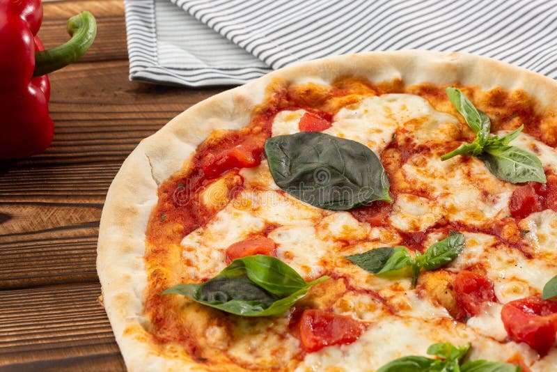 Pizza Margherita on wooden background, top view. Pizza Margarita with Tomatoes, Basil and Mozzarella Cheese close up. royalty free stock photo Pizza Margherita on wooden background, top view. Pizza Margarita with Tomatoes, Basil and Mozzarella Cheese close up. royalty free stock photo