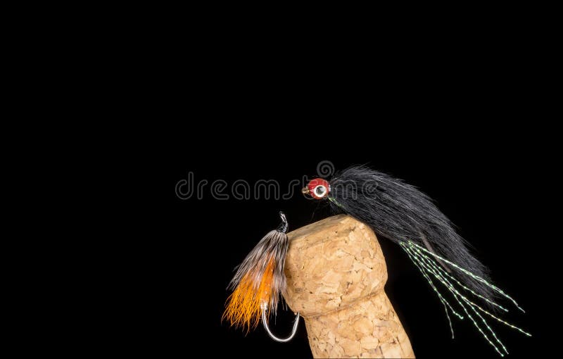 Flyger den färgrika handen bundet fiske visat på Champagne Cork 5 royaltyfria foton Flyger den färgrika handen bundet fiske visat på Champagne Cork 5 royaltyfria foton
