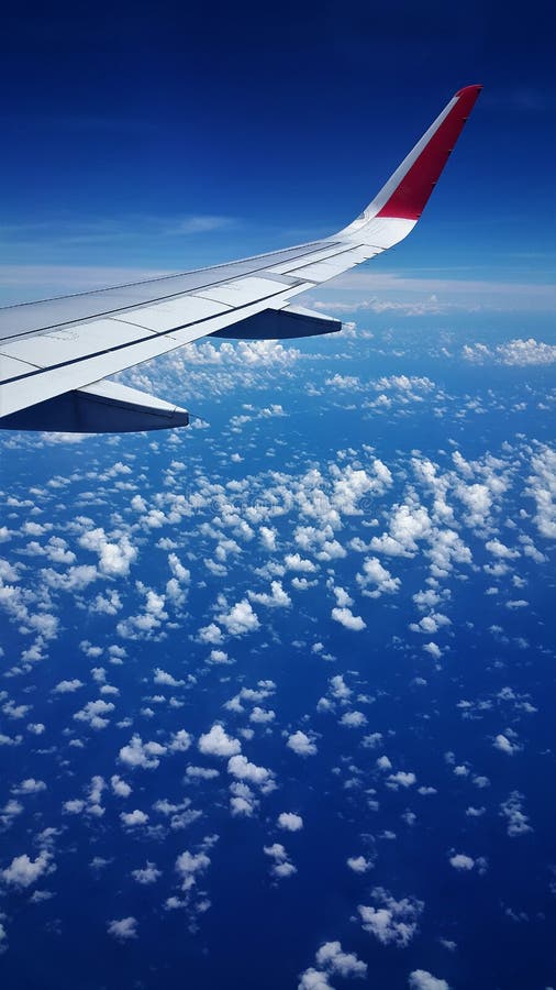 Flygplansikt av det blåa havet och blå himmel royaltyfria foton Flygplansikt av det blåa havet och blå himmel royaltyfria foton