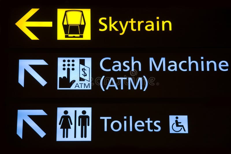 Directions to terminal connecting train, cash machine and restrooms at an airport. Directions to terminal connecting train, cash machine and restrooms at an airport