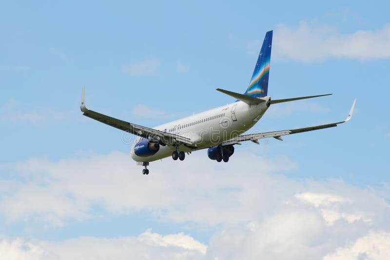 Flying away in a cloudy sky airplane Boeing 737-800NG VP-BEP airline Yakutia