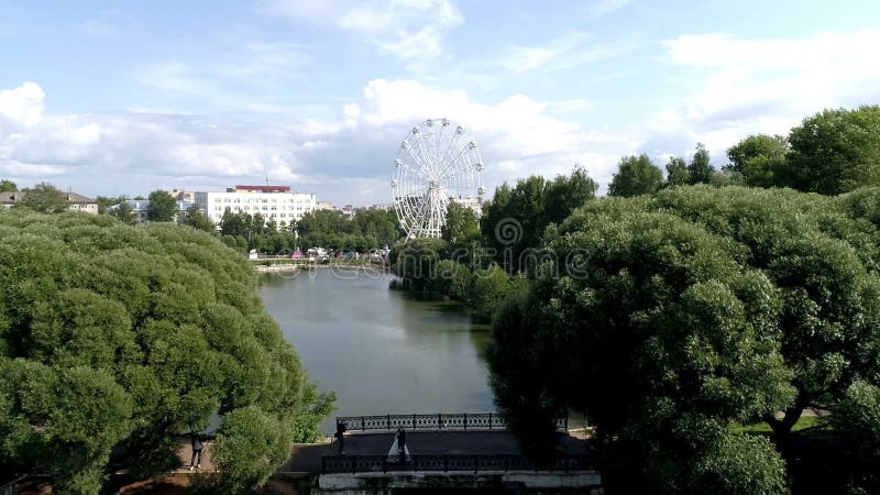 Copter flight over the city Park pond river