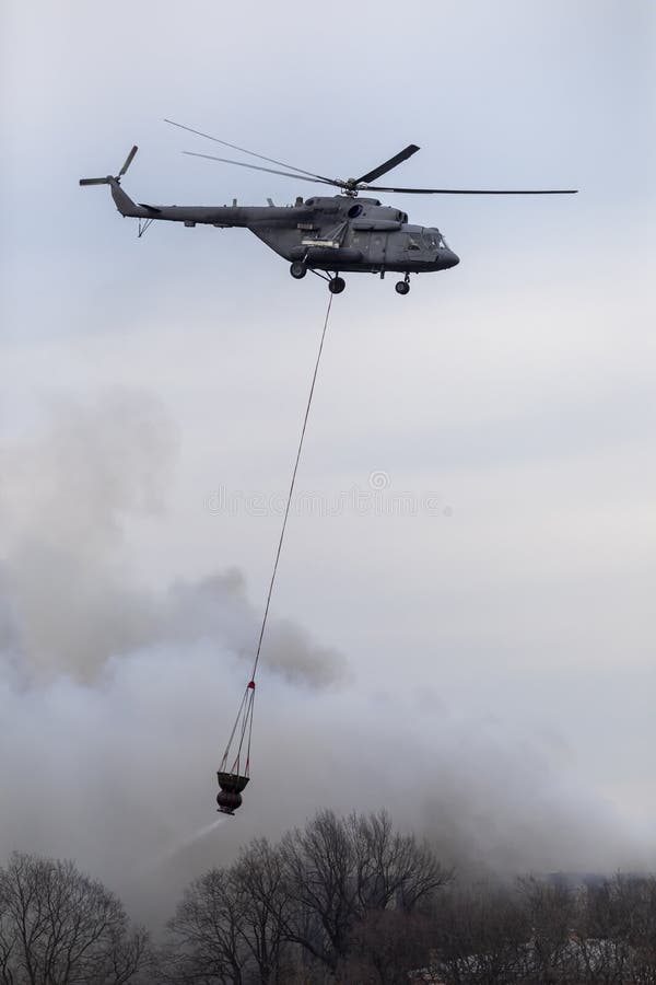 Firefighter Helicopter with a Water Tank in Smoke from a Fire Stock Photo Image of military