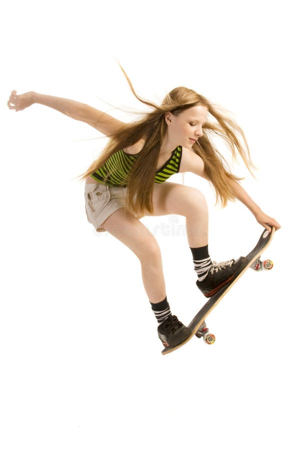 Young skateboarder flying through the air, isolated on white background. Young skateboarder flying through the air, isolated on white background