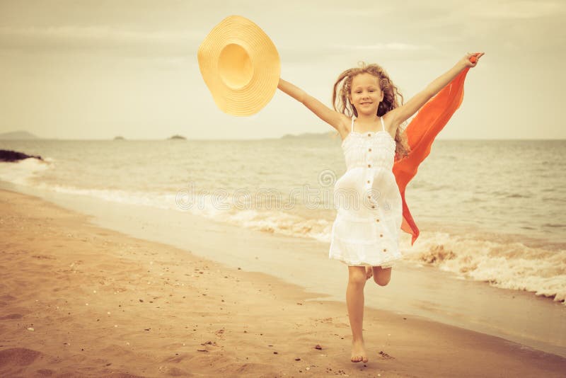 Flying jump beach girl on blue sea shore