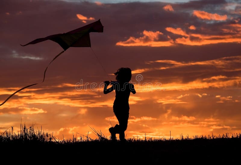 Flying a kite at sunset. stock photo. Image of lucky - 15936652
