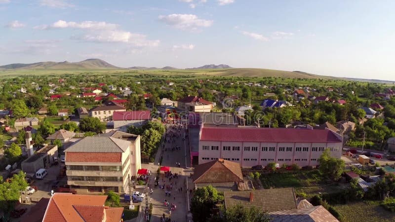 Flying over a small village in celebration day