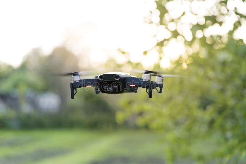 Flying quadrocopter, remote controlled drone with camera stock images