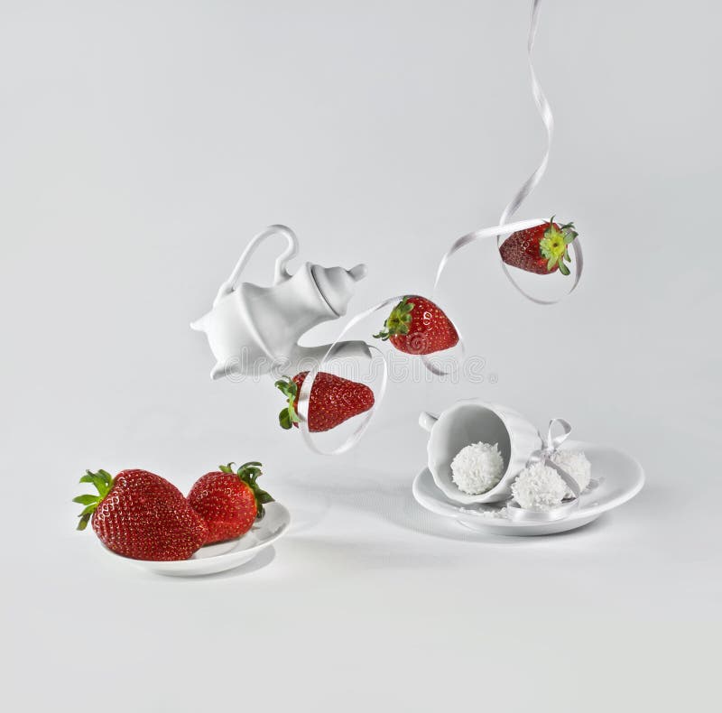 Flying strawberries with white ribbon.