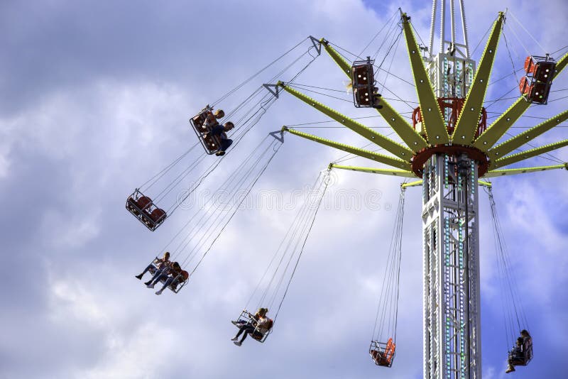 People Enjoy a Ride on a Flying Swing Ride at an Amusement Park Editorial  Stock Image - Image of family, chair: 156925894
