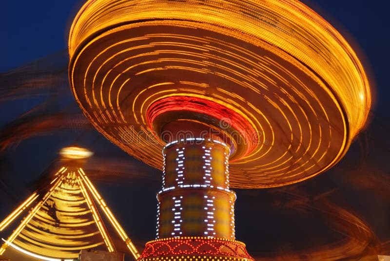 Flying swing at night stock image