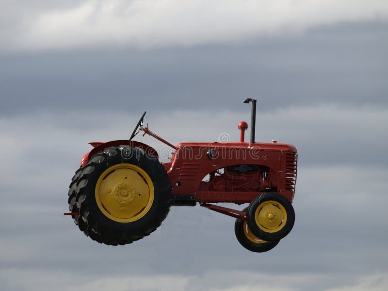 Flying tractor. royalty free stock photos