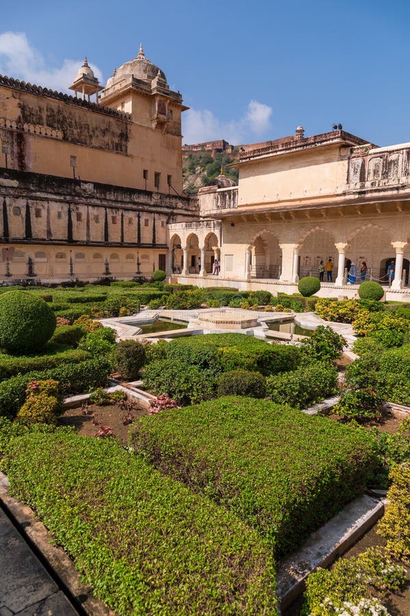 Sheesh Mahal and garden, Amber Fort, Amer, Rajasthan, India, Pavilion in the Amber Fort built for use by the imperial family, famous for intricate mirror-work. A narrow 4WD road leads up to the entrance gate, known as the Suraj Pol (Sun Gate) of the fort. It is now considered much more ethical for tourists to take jeep rides up to the fort, instead of riding the elephants. Amer Fort or Amber Fort is a fort located in Amer, Rajasthan, India. Amer is a town with an area of 4 square kilometres (1.5 sq mi) located 11 kilometres (6.8 mi) from Jaipur, the capital of Rajasthan. Located high on a hill, it is the principal tourist attraction in Jaipur. Amer Fort is known for its artistic style elements. With its large ramparts and series of gates and cobbled paths, the fort overlooks Maota Lake which is the main source of water for the Amer Palace. Sheesh Mahal and garden, Amber Fort, Amer, Rajasthan, India, Pavilion in the Amber Fort built for use by the imperial family, famous for intricate mirror-work. A narrow 4WD road leads up to the entrance gate, known as the Suraj Pol (Sun Gate) of the fort. It is now considered much more ethical for tourists to take jeep rides up to the fort, instead of riding the elephants. Amer Fort or Amber Fort is a fort located in Amer, Rajasthan, India. Amer is a town with an area of 4 square kilometres (1.5 sq mi) located 11 kilometres (6.8 mi) from Jaipur, the capital of Rajasthan. Located high on a hill, it is the principal tourist attraction in Jaipur. Amer Fort is known for its artistic style elements. With its large ramparts and series of gates and cobbled paths, the fort overlooks Maota Lake which is the main source of water for the Amer Palace.