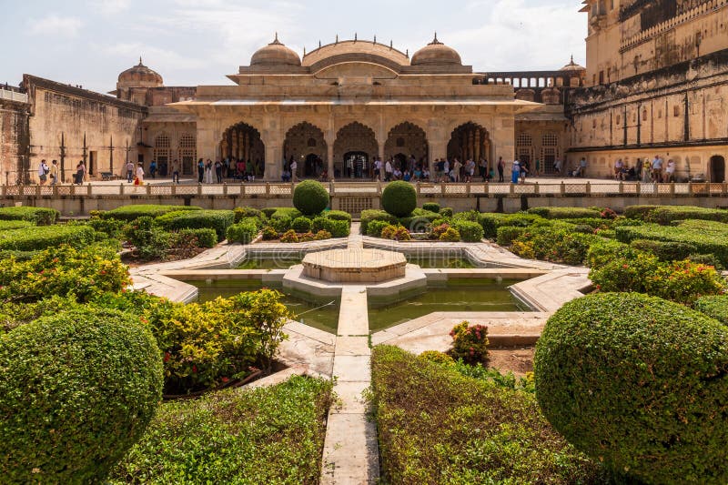 Sheesh Mahal and garden, Amber Fort, Amer, Rajasthan, India, Pavilion in the Amber Fort built for use by the imperial family, famous for intricate mirror-work. A narrow 4WD road leads up to the entrance gate, known as the Suraj Pol (Sun Gate) of the fort. It is now considered much more ethical for tourists to take jeep rides up to the fort, instead of riding the elephants. Amer Fort or Amber Fort is a fort located in Amer, Rajasthan, India. Amer is a town with an area of 4 square kilometres (1.5 sq mi) located 11 kilometres (6.8 mi) from Jaipur, the capital of Rajasthan. Located high on a hill, it is the principal tourist attraction in Jaipur. Amer Fort is known for its artistic style elements. With its large ramparts and series of gates and cobbled paths, the fort overlooks Maota Lake which is the main source of water for the Amer Palace. Sheesh Mahal and garden, Amber Fort, Amer, Rajasthan, India, Pavilion in the Amber Fort built for use by the imperial family, famous for intricate mirror-work. A narrow 4WD road leads up to the entrance gate, known as the Suraj Pol (Sun Gate) of the fort. It is now considered much more ethical for tourists to take jeep rides up to the fort, instead of riding the elephants. Amer Fort or Amber Fort is a fort located in Amer, Rajasthan, India. Amer is a town with an area of 4 square kilometres (1.5 sq mi) located 11 kilometres (6.8 mi) from Jaipur, the capital of Rajasthan. Located high on a hill, it is the principal tourist attraction in Jaipur. Amer Fort is known for its artistic style elements. With its large ramparts and series of gates and cobbled paths, the fort overlooks Maota Lake which is the main source of water for the Amer Palace.