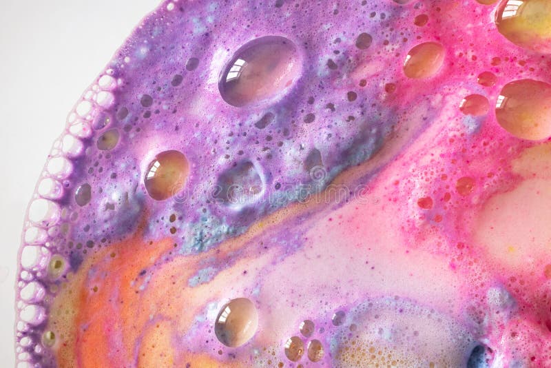 Foam with bubbles of bath bomb macro colorful stock images