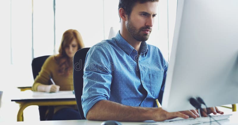 Focus, computer or man in office for cybersecurity, app coding or networking. Programmer, developer or employee typing royalty free stock photo