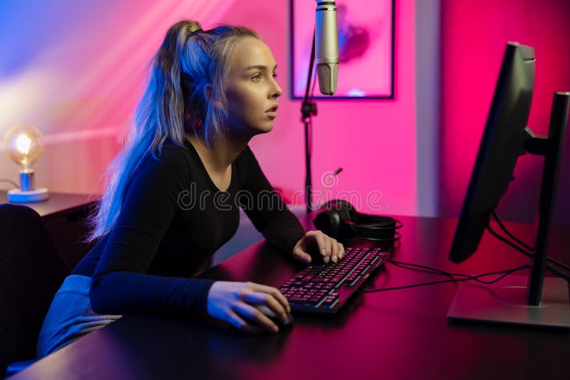 Happy Pretty Blonde Gamer Girl Playing Online Video Game on Her Personal  Computer Stock Photo - Alamy