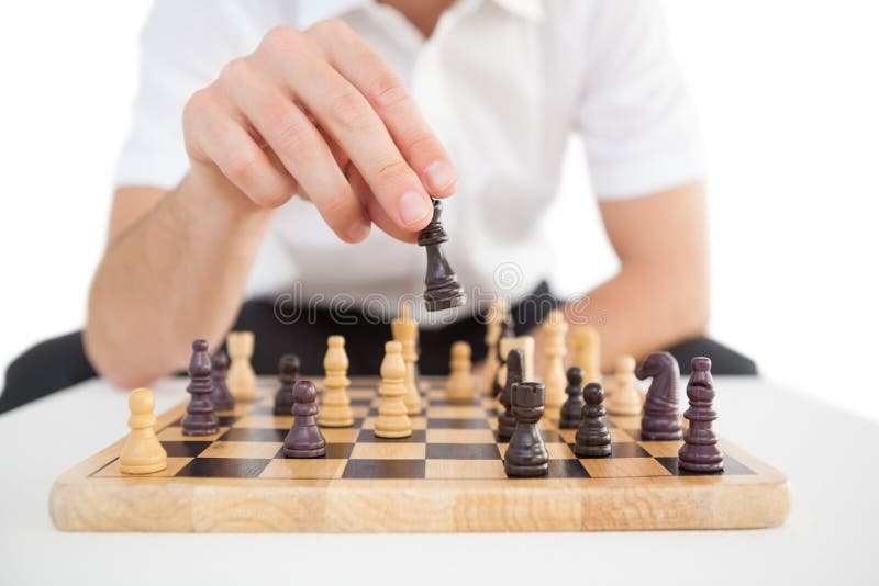 Focused businessman playing chess solo royalty free stock image