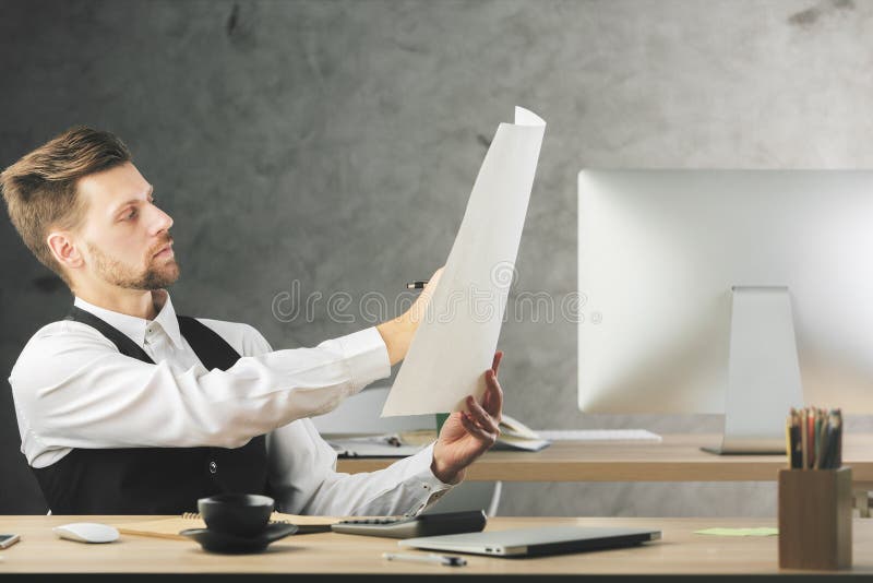 Focused businessman with project stock images