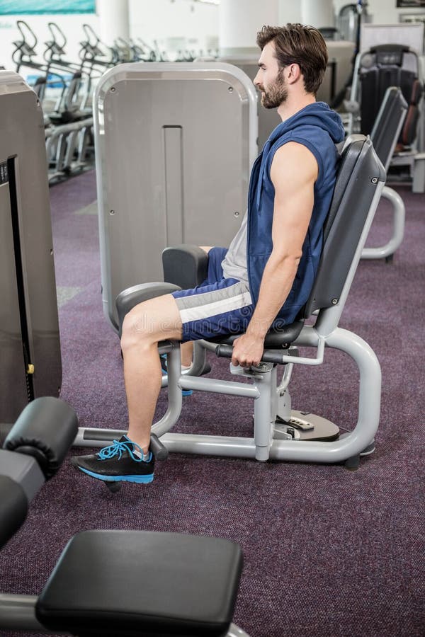 Focused Man Using Weights Machine for Legs Stock Image Image of adult
