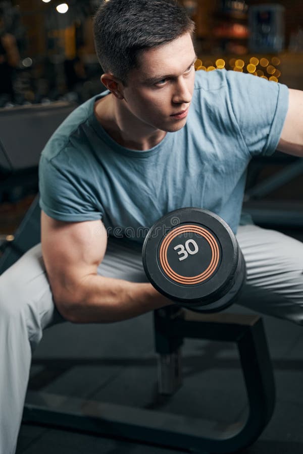 Focused Muscular Young Man Doing Bicep Curl Stock Image Image Of