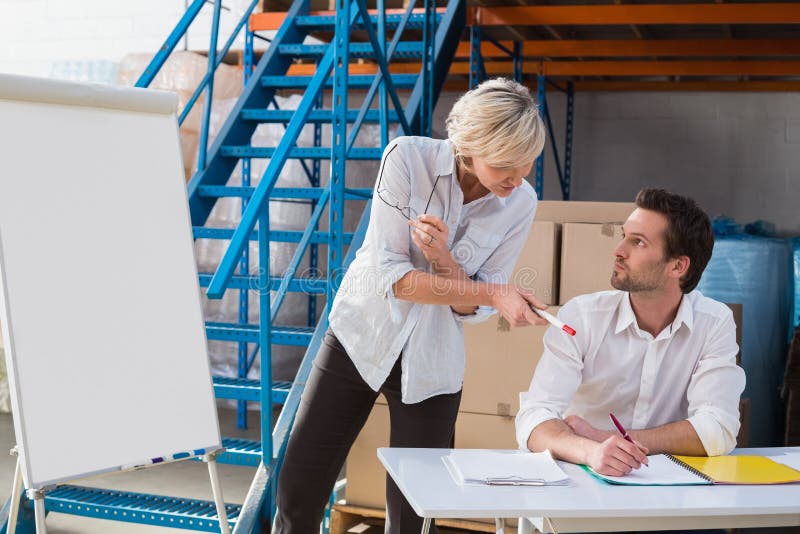 Focused warehouse managers during a presentation royalty free stock photo