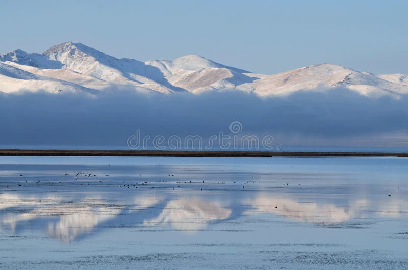 Fog over Son-Kul mountain lake early in the morning,central Tien Shan.Name translation is `the last lake`, Kyrgyzstan,Central Asi stock photo Fog over Son-Kul mountain lake early in the morning,central Tien Shan.Name translation is `the last lake`, Kyrgyzstan,Central Asi stock photo