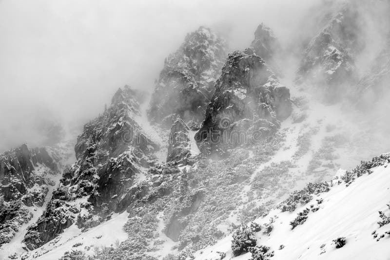 Fog in top of the rocky peaks