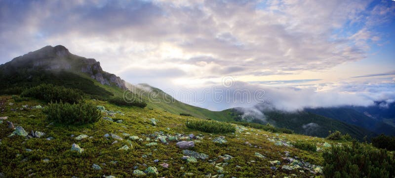 Foggy and cloudy mountains panorama