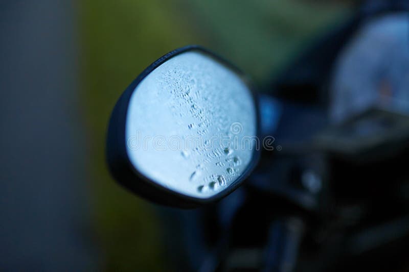 The Foggy Mirror and the Speedometer on the Scooter are Covered with
