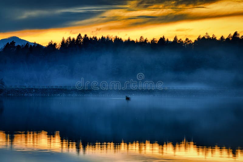 Foggy sunset stock photo