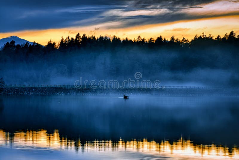 Foggy sunset royalty free stock images