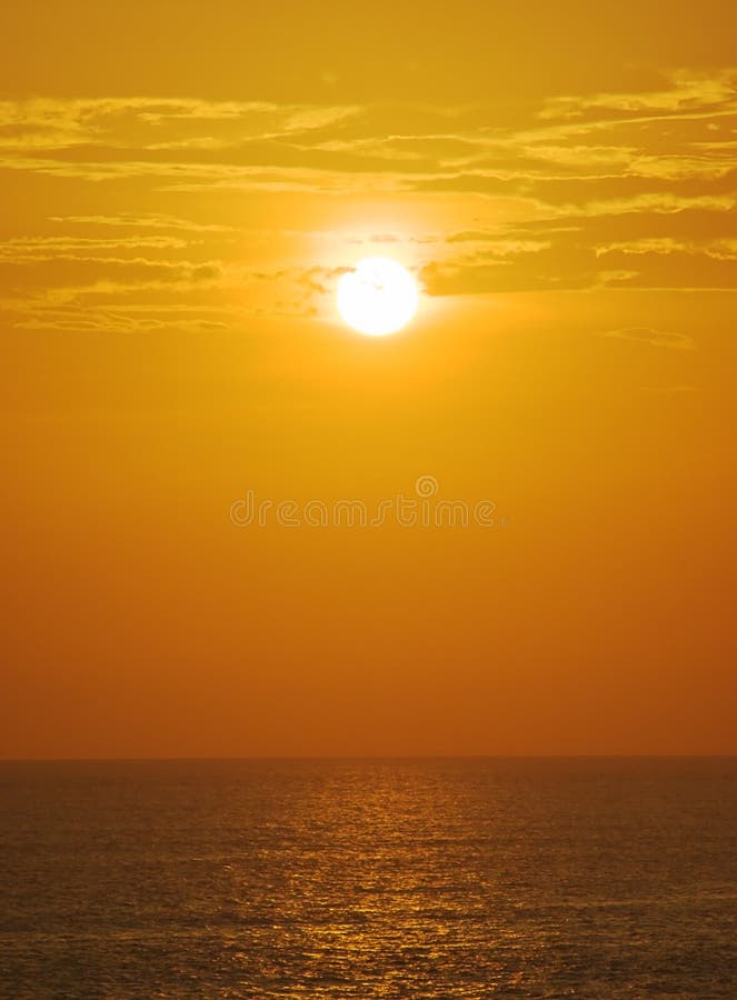 Foggy sunset over ocean