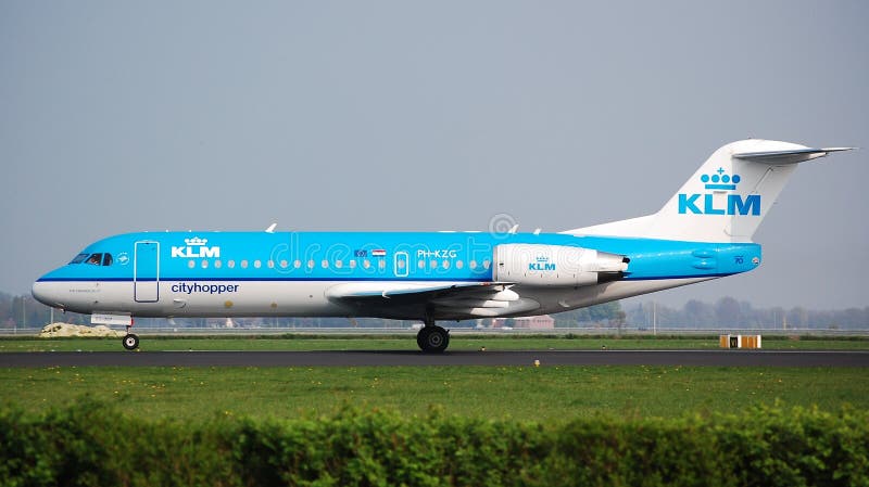 A KLM Cityhopper Fokker 70 aircraft at Schiphol Airport. These Fokkers are slowly being replaced by brand new Embraer aircraft. A KLM Cityhopper Fokker 70 aircraft at Schiphol Airport. These Fokkers are slowly being replaced by brand new Embraer aircraft.