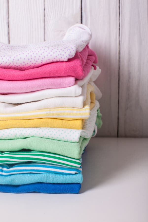 Folded baby clothes stock image. Image of child, colorful - 87423899